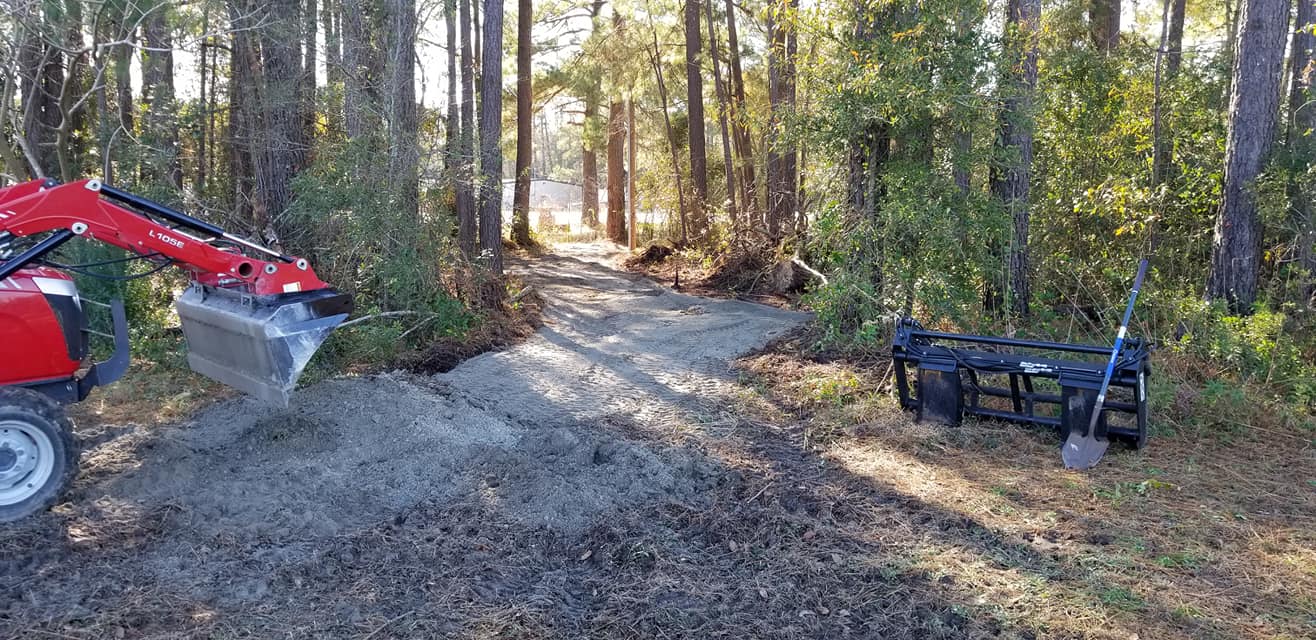 Longs, removed old driveway, made new driveway through woods and used old material