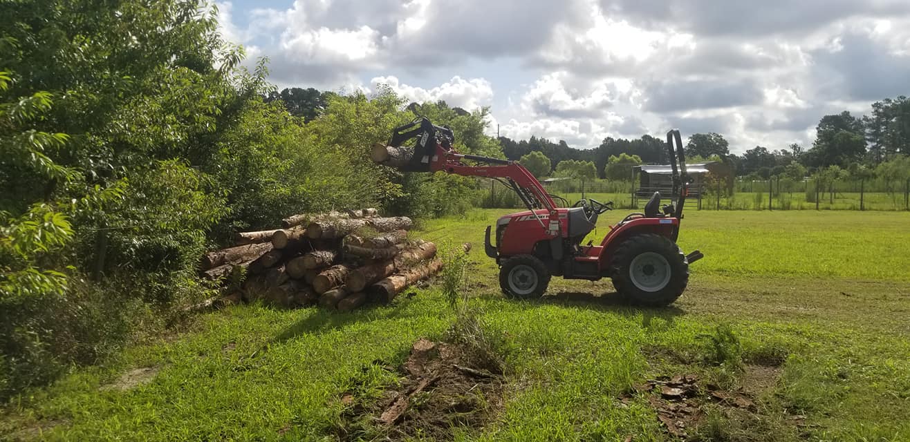 Longs, cut logs and move into piles and move debris