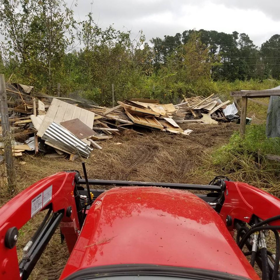 Longs, move old chicken coops and pile on another part of property
